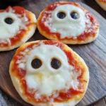 Spooktacular Mini Ghost Pizzas That Are Eerily Easy to Make